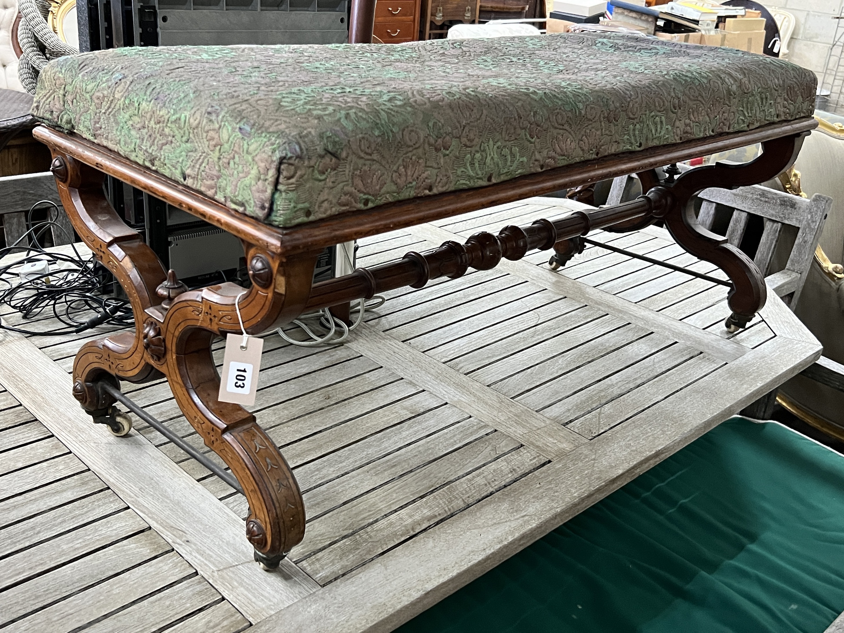 A late Victorian Aesthetic movement walnut X frame window seat, width 115cm, depth 48cm, height 50cm